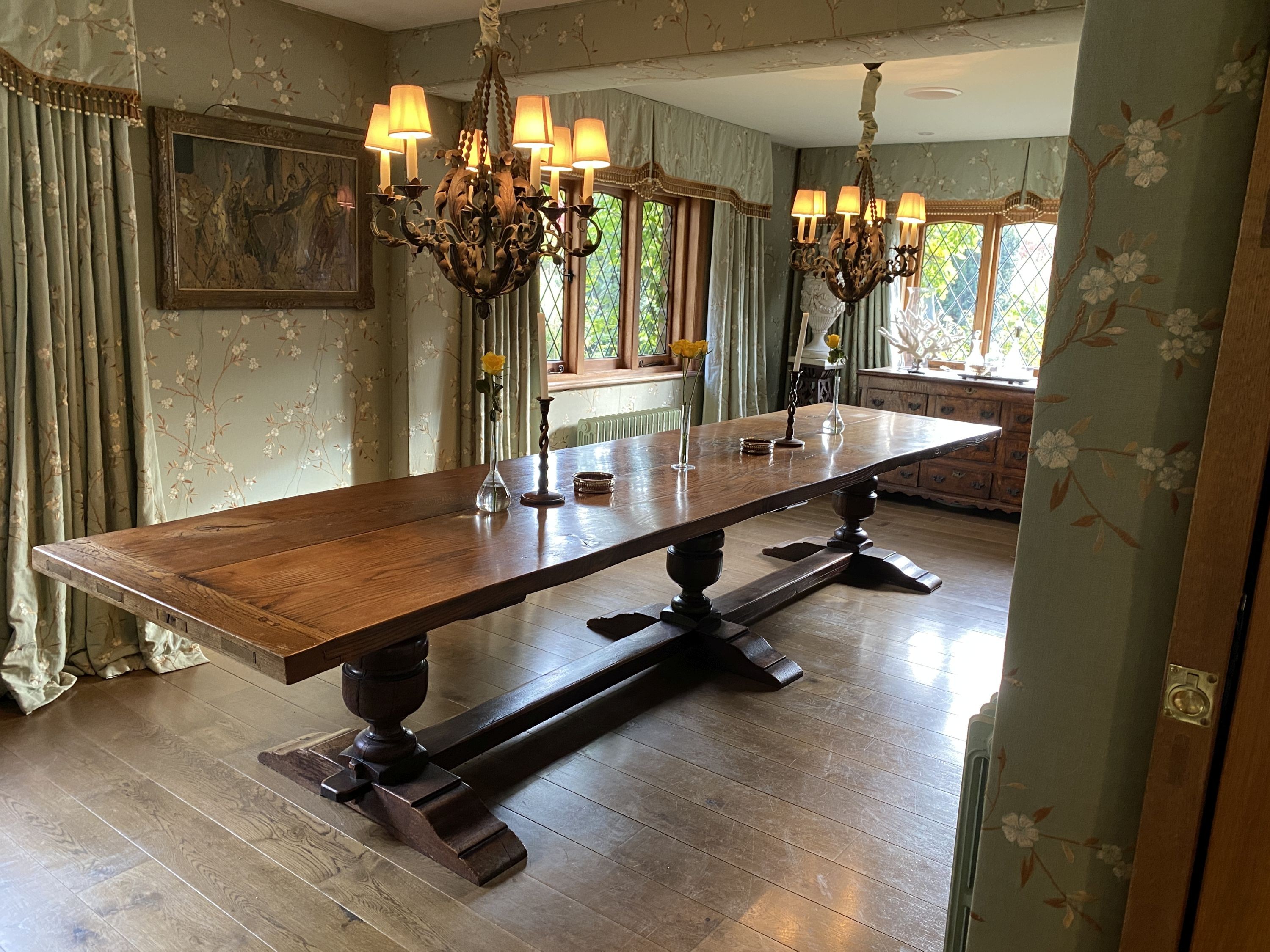 An impressively large 17th century style oak refectory table, with twin plank top on triple baluster supports and trestle foot, width 430cm depth 99cm height 74cm